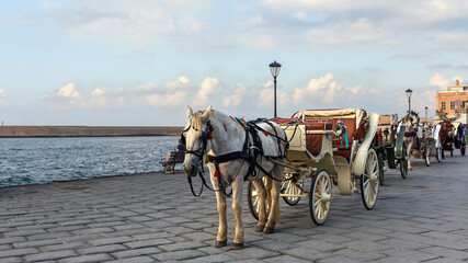 Cart with a horse for tourists in the port of the Greek city of Chania