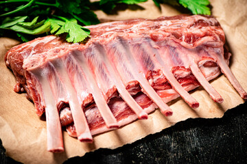 Raw rack of lamb with parsley. 