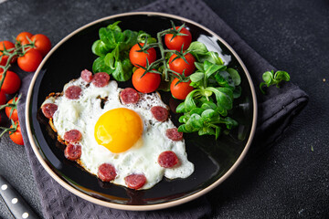 breakfast fried egg sausage, vegetable fresh meal snack on the table copy space food background rustic top view