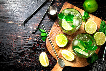 Mojito with mint castings. Against a dark background.