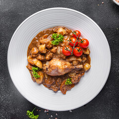 rooster in wine cuisine vegetable, cgicken meat dish meal food snack on the table copy space food background rustic top view