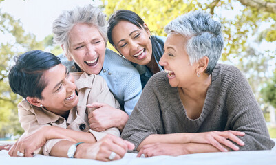 Wellness, happy and retirement women friends laugh in park for group bonding and relaxing lifestyle. Funny joke and smile of senior people in interracial friendship in nature together.