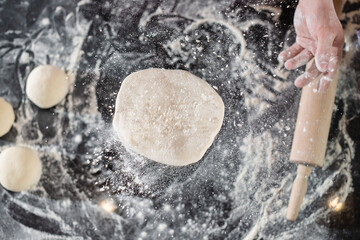 pizzaiolo prepares pizza in the kitchen, the chef prepares the dough