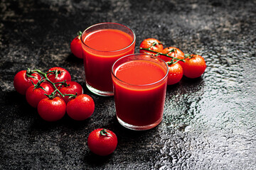 Juice from ripe tomatoes in a glass. 