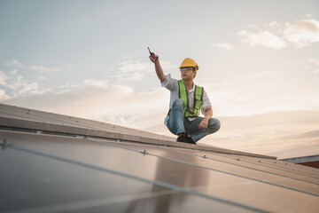 Service engineer checking solar cell on the roof for maintenance if there is a damaged part. Engineer worker install solar panel. Clean energy concept.