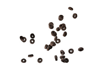 Chocolate rings cereal spill out into a bowl. Breakfast.