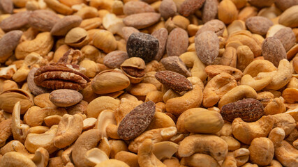 A group of almonds, pistachios, walnuts, macadamia, cashews.