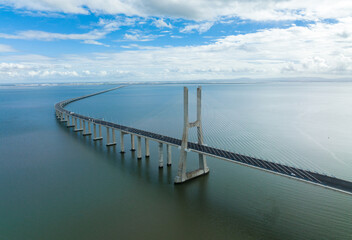 Fototapeta na wymiar Vasco Da Gama Bridge in Lisbon, Portugal over the Tagus River. Drone Point of View