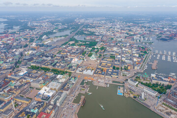 Helsinki Downtown Cityscape, Finland. Cathedral Square, Market Square, Sky Wheel, Port, Harbor in Background. Drone Point of View