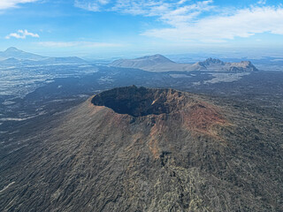 Aerial views over the black volcano (Jabal Qidr) in Harrat Khaybar, north west Saudi Arabia