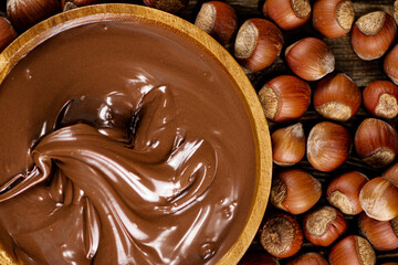 Hazelnut butter on a wooden plate. 