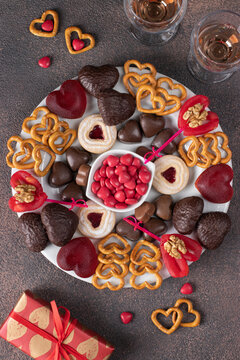 Plate of assorted heart sweets for Valentine's Day, top view
