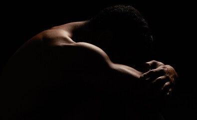 Nude, man with muscle and isolated on black background, strong and skin, silhouette and body in a...