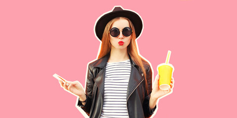 Portrait of stylish young woman model posing with cup of juice and phone blowing her lips wearing black round hat, leather biker rock jacket on pink background, magazine style