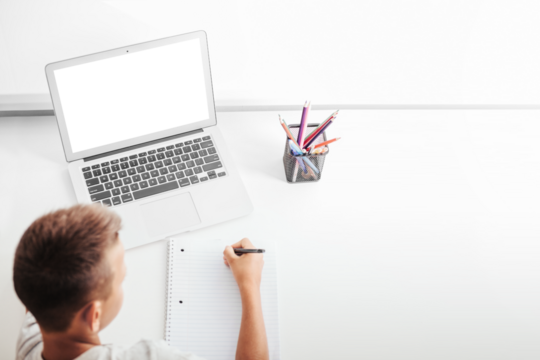 school at home through online homeschooling. the child is sitting at the computer
