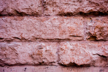 Old but solid brick wall in close up view displaying texture.