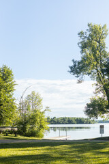 Canoes by dock on lake