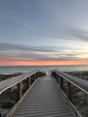 Obraz na płótnie Canvas Walkway with sunset sky background over the Gulf of Mexico Emerald Coast Florida 
