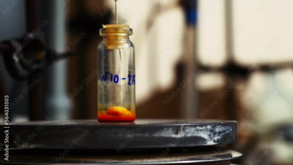 Poster laboratory test tube with rotating particle and liquid. stock footage. rotating liquid in test tube 