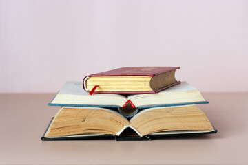 open books on beige background, copy space