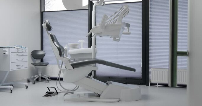 Modern Room with dental chair and medical equipment. Modern Dental office. Modern dental practice. Dental chair and other accessories. clinic equipment.