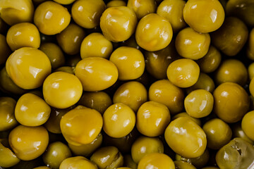 A pile of canned green peas. 