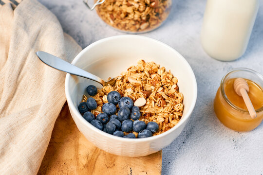 Fresh fragrant homemade granola made from oatmeal, honey and nuts. Balanced breakfast or snack