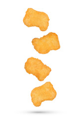 Fried chicken nuggets falling in the air isolated on transparent background. PNG