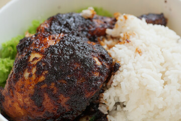 close up of slice of grill chicken on a plate 