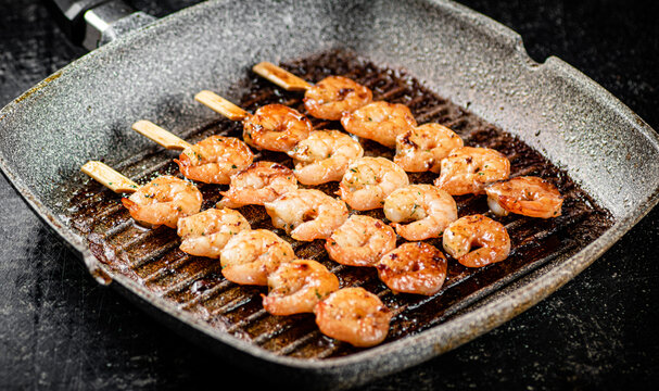Grilled shrimp in a frying pan. 