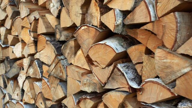 Close-up of firewood supply. Media. Lots of chopped firewood for winter. Supplies of firewood in village for winter