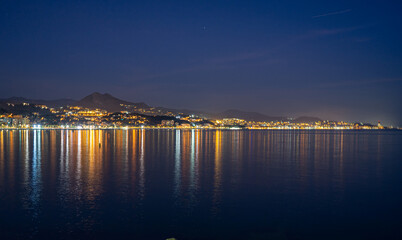 Fototapeta na wymiar Panoramic view of night Malaga coastline, beach Malageta in Malaga, Spain on January 14, 2023