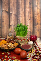 A festive table in honor of Navruz. Wheat, dried fruits, nuts, dyed eggs, sumac, garlic and vinegar. The traditional holiday of the vernal equinox Navruz