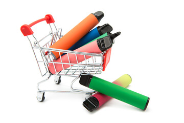 Set of colorful disposable electronic cigarettes in supermarket grocery shopping cart isolated on...