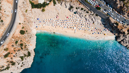 Aerial view of Kaputas beach between Kas and Kalkan, Turkey . Drone view of beach with beautiful,clear turquoise waters of the Mediterranean Sea. Popular and famous place for tourists - Powered by Adobe