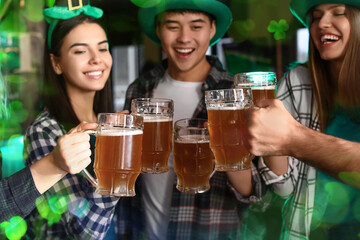 Happy young friends with beer celebrating St. Patrick's Day in pub