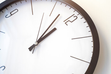 Obraz na płótnie Canvas time concept with clock or clock on white wall