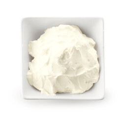 Bowl of tasty cream cheese isolated on white background