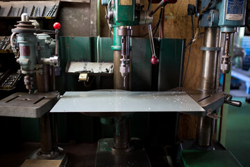 Part machining with drilling machine