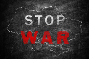 Words Stop War and outline map of Ukraine on blackboard