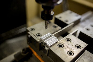 Fototapeta na wymiar Parts processing at machining center