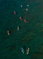 Group of athlets  kayaking   in the sea. People active