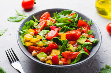 Vegetable Salad, Healthy Eating, Vegetarian Salad with Chickpeas, Avocado, Pepper, Spinach, Cherry Tomatoes in a Bowl