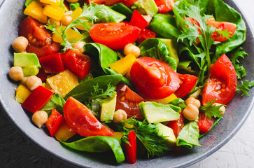 Vegetable Salad, Healthy Eating, Vegetarian Salad with Chickpeas, Avocado, Pepper, Spinach, Cherry Tomatoes in a Bowl