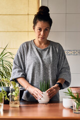 Woman seeding a plant