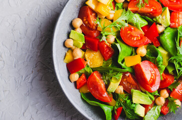 Vegetable Salad, Healthy Eating, Vegetarian Salad with Chickpeas, Avocado, Pepper, Spinach, Cherry Tomatoes in a Bowl