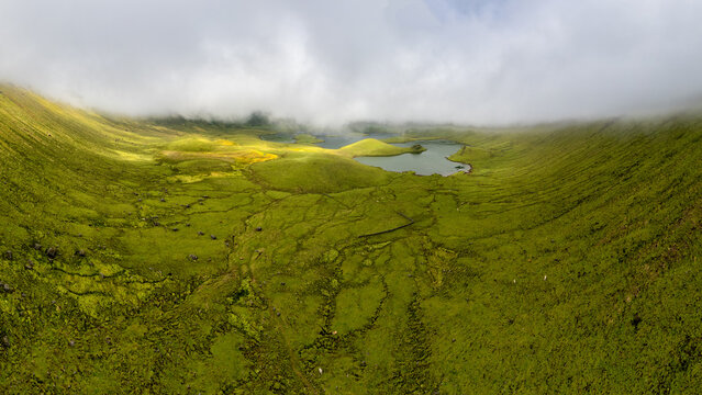 Natural landscape, panoramic view. Beautiful lagoon in the volcanic Caldeirao crater an at Corvo island, Azores, Portugal. Nature and science in this amasing tavel destination.