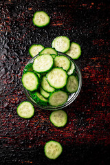 Sliced cucumbers in a glass bowl. 