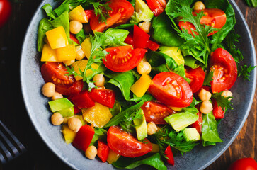 Vegetable Salad, Healthy Eating, Vegetarian Salad with Chickpeas, Avocado, Pepper, Spinach, Cherry Tomatoes in a Bowl