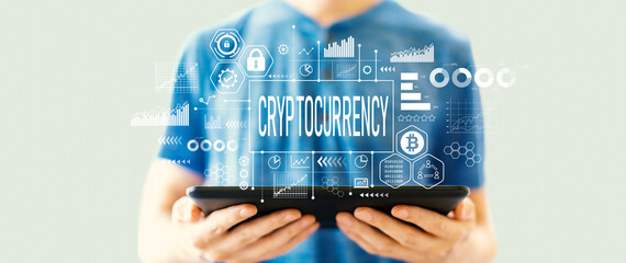 Cryptocurrency theme with man using a tablet